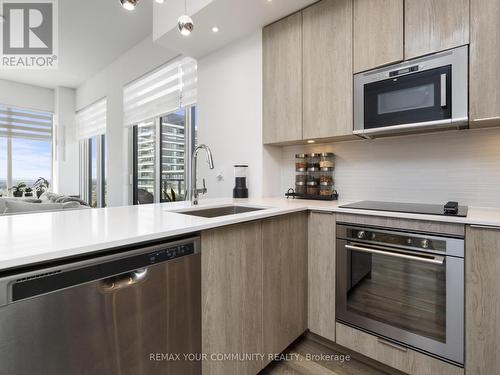 Stainless steel built-in appliances - 1012 - 99 Eagle Rock Way, Vaughan, ON - Indoor Photo Showing Kitchen With Upgraded Kitchen
