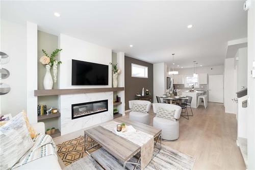 109 Ken Oblik Drive, Winnipeg, MB - Indoor Photo Showing Living Room With Fireplace