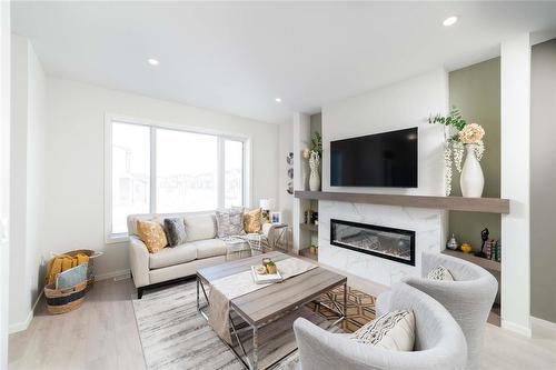 109 Ken Oblik Drive, Winnipeg, MB - Indoor Photo Showing Living Room With Fireplace