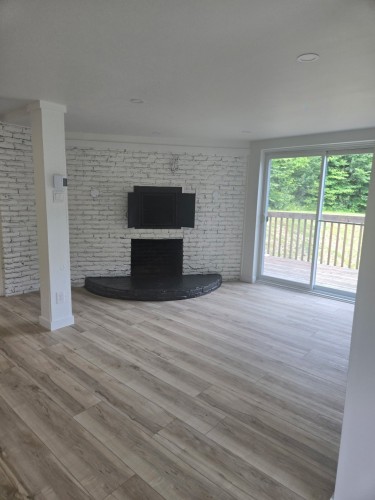 Salle familiale - 1273 Ch. Du Mont-Loup-Garou, Sainte-Adèle, QC - Indoor Photo Showing Living Room With Fireplace