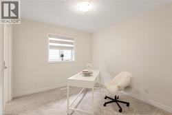 Neutral wall colors complement the light-toned carpeting throughout this versatile room - 
