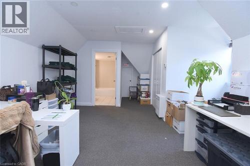 Carpeted room with sloped ceilings and recessed lighting - 108 George Street, Hamilton, ON 