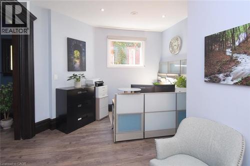 Bright room featuring wood-finish flooring and light blue walls - 108 George Street, Hamilton, ON 