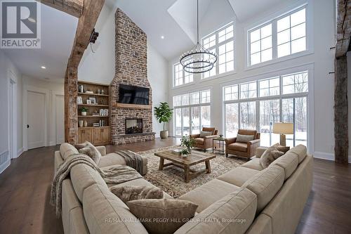 16 Heron Boulevard, Springwater, ON - Indoor Photo Showing Living Room With Fireplace