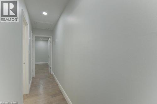 Hallway featuring light wood-finish flooring, recessed lighting, and crisp white trim - 80 Lower Canada Crescent, Kitchener, ON - Indoor Photo Showing Other Room