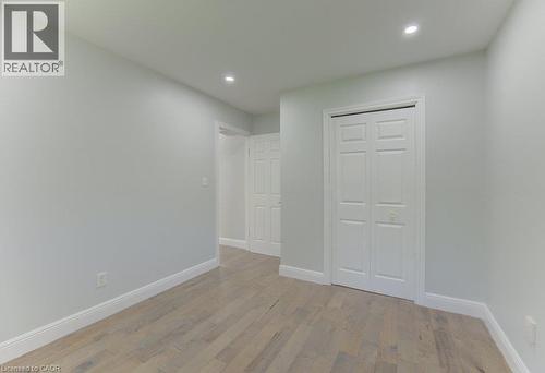 Interior room featuring light wood-finish flooring, white baseboards, and light gray wall paint - 80 Lower Canada Crescent, Kitchener, ON - Indoor Photo Showing Other Room