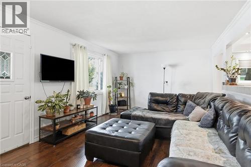Living area featuring wood-finish flooring, white walls, and crown molding - 432 Upper Sherman Avenue, Hamilton, ON - Indoor Photo Showing Living Room