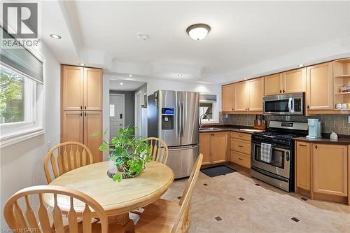 Kitchen featuring recessed lighting, light wood cabinetry, stainless steel appliances, and a tiled backsplash - 432 Upper Sherman Avenue, Hamilton, ON - Indoor