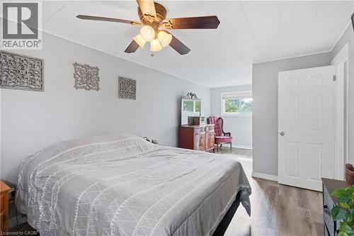 Spacious room featuring light gray walls and wood-finish flooring - 432 Upper Sherman Avenue, Hamilton, ON - Indoor Photo Showing Bedroom