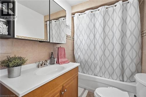 Bathroom vanity featuring a white countertop, undermount sink, and brushed nickel faucet - 432 Upper Sherman Avenue, Hamilton, ON - Indoor Photo Showing Bathroom