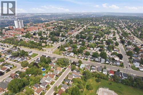 Expansive aerial view showcasing a residential neighborhood with numerous single-family homes, mature trees, and a network of streets - 432 Upper Sherman Avenue, Hamilton, ON - Outdoor With View
