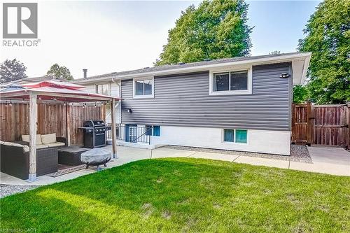 Rear exterior with gray horizontal siding and white trim - 323 Cranbrook Drive, Hamilton, ON - Outdoor With Exterior