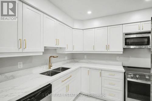12 - 125 Sekura Crescent, Cambridge, ON - Indoor Photo Showing Kitchen With Double Sink