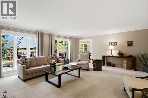 Spacious interior room featuring light-colored carpet flooring and neutral wall tones - 1090 Crofton Way, Burlington, ON - Indoor Photo Showing Living Room