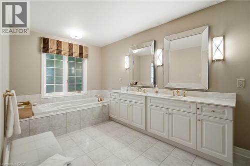 Bathroom featuring a double vanity with white cabinetry and countertops - 1090 Crofton Way, Burlington, ON - Indoor Photo Showing Bathroom
