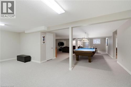 Expansive recreation area featuring light-colored carpeting, recessed lighting, and a neutral wall palette - 1090 Crofton Way, Burlington, ON - Indoor Photo Showing Other Room