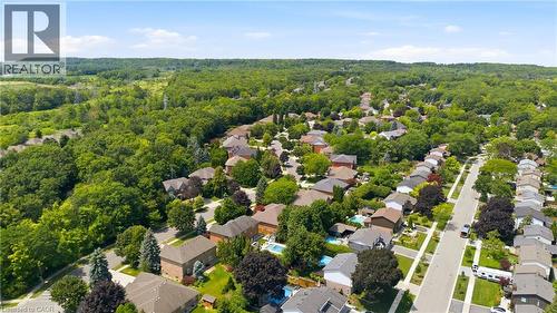 Aerial perspective showcasing a residential area with varied architectural styles and extensive mature trees - 1090 Crofton Way, Burlington, ON - Outdoor With View