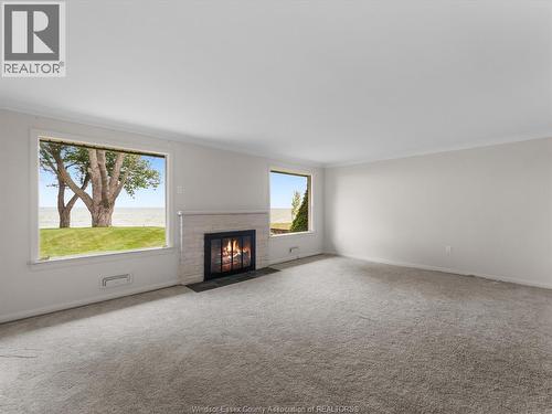 11506 Riverside, Windsor, ON - Indoor Photo Showing Living Room With Fireplace