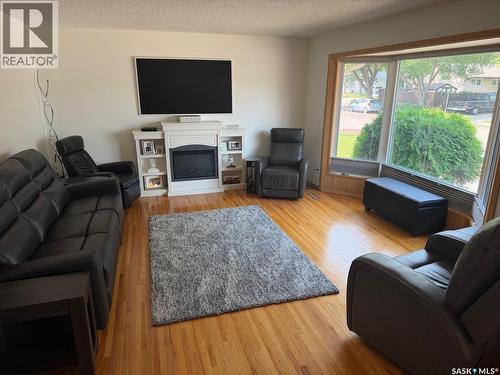 107 Merlin Crescent, Regina, SK - Indoor Photo Showing Living Room With Fireplace