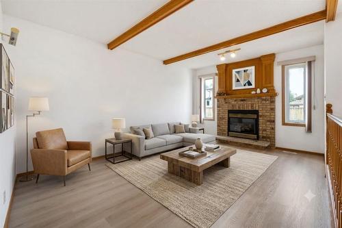 64 Simkin Drive, Winnipeg, MB - Indoor Photo Showing Living Room With Fireplace
