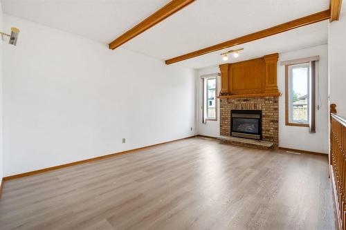 64 Simkin Drive, Winnipeg, MB - Indoor Photo Showing Living Room With Fireplace