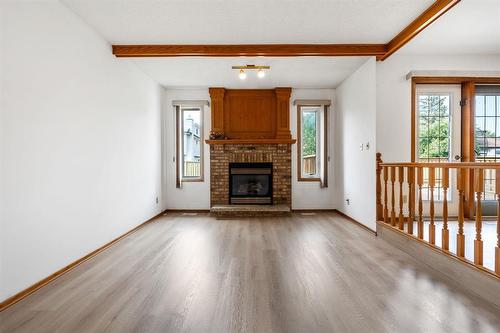 64 Simkin Drive, Winnipeg, MB - Indoor Photo Showing Living Room With Fireplace