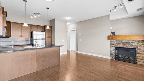 212-3533 Carrington Road, West Kelowna, BC - Indoor Photo Showing Kitchen With Fireplace