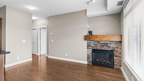 212-3533 Carrington Road, West Kelowna, BC - Indoor Photo Showing Other Room With Fireplace