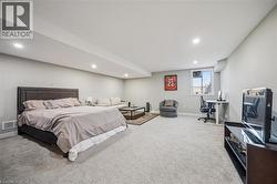 Spacious carpeted room featuring recessed lighting, a window, and light gray walls - 