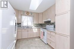 Main Floor Kitchen - Loads of cupboard space - 