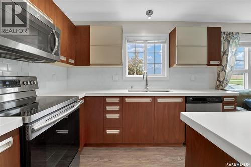 102 110 Phelps Way, Saskatoon, SK - Indoor Photo Showing Kitchen With Double Sink