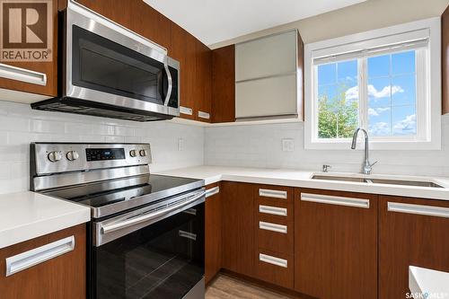 102 110 Phelps Way, Saskatoon, SK - Indoor Photo Showing Kitchen With Double Sink