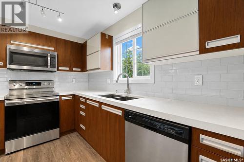 102 110 Phelps Way, Saskatoon, SK - Indoor Photo Showing Kitchen With Stainless Steel Kitchen With Double Sink