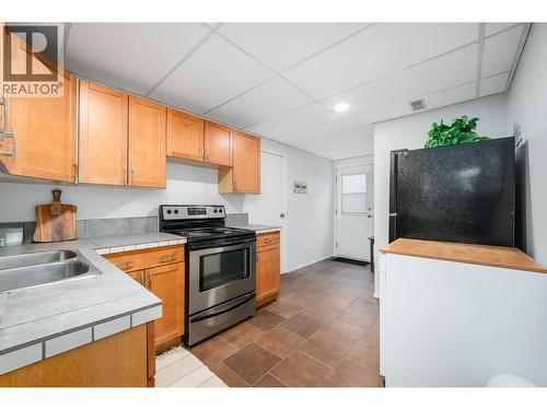 110 Wyndham Crescent, Kelowna, BC - Indoor Photo Showing Kitchen With Double Sink