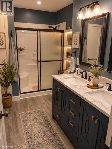 Double vanity with quartz countertop, dual undermount sinks, and matte black faucets - 143 Grenfell Place, London, ON - Indoor Photo Showing Bathroom