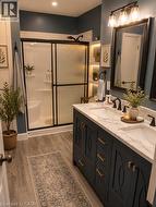 Double vanity with quartz countertop, dual undermount sinks, and matte black faucets - 