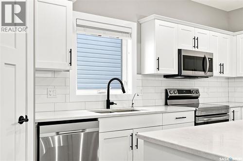 247 Thakur Street, Saskatoon, SK - Indoor Photo Showing Kitchen With Double Sink