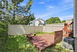 Fenced rear yard with deck - 