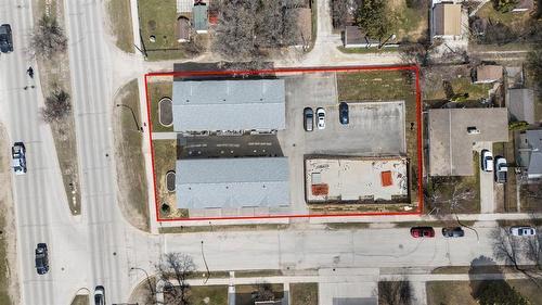 Rare opportunity to acquire a 9-unit complex with 6 fully rented units already constructed. The property features two 1,700 sq ft triplex buildings with oversized attached heated garages, plus a p... - 210 Main Street, Selkirk, MB - 