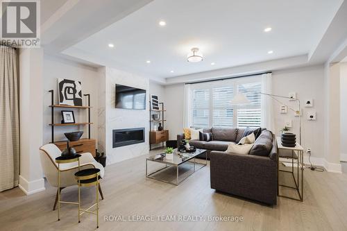 Photo provided to showcase builders finishes only. - 3025 Weecay Circle, Ottawa, ON - Indoor Photo Showing Living Room With Fireplace