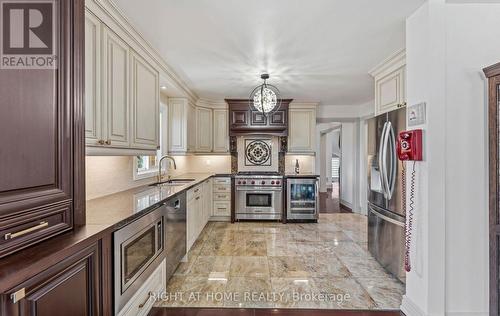 Kitchen with Built-In Appliances and Wine Fridge - 1665 Asgard Drive, Mississauga, ON - Indoor Photo Showing Kitchen With Double Sink With Upgraded Kitchen