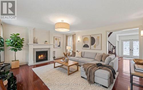 Fam Room  Wood-Burning Fireplace -Digitally staged - 1665 Asgard Drive, Mississauga, ON - Indoor Photo Showing Living Room With Fireplace