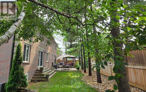 Mature trees frame the backyard oasis. - 1665 Asgard Drive, Mississauga, ON - Outdoor