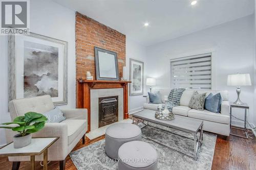 Lower - 57 Bertmount Avenue, Toronto, ON - Indoor Photo Showing Living Room With Fireplace