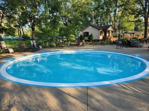 Pool - 1125-2555 Av. Du Havre-Des-Îles, Laval (Chomedey), QC - Outdoor With In Ground Pool With Backyard