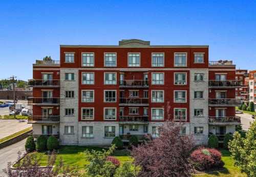 Façade - 205-100 Rue Barnett, Dollard-Des-Ormeaux, QC - Outdoor With Balcony With Facade