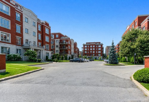 Stationnement - 205-100 Rue Barnett, Dollard-Des-Ormeaux, QC - Outdoor With Balcony With Facade
