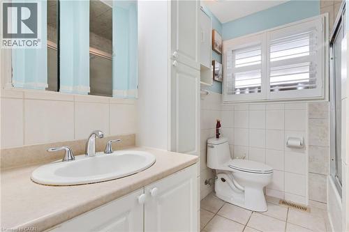 Bathroom featuring a vanity with an integrated sink, polished chrome faucet, and white cabinetry - 744 Birchwood Avenue, Cambridge, ON - Indoor Photo Showing Bathroom
