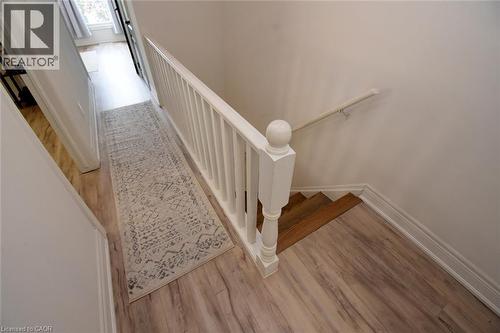 Hallway with wood-finish flooring and white baseboards - 106 Belview Avenue, Hamilton, ON - Indoor Photo Showing Other Room