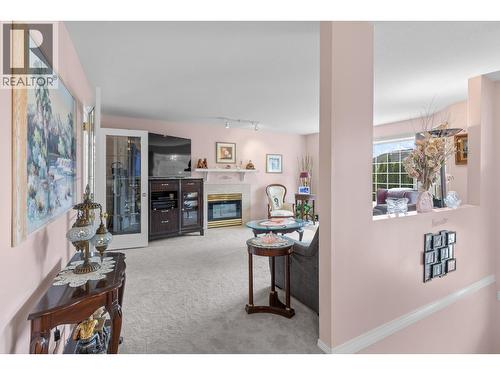 280 Cosens Court, Kelowna, BC - Indoor Photo Showing Other Room With Fireplace